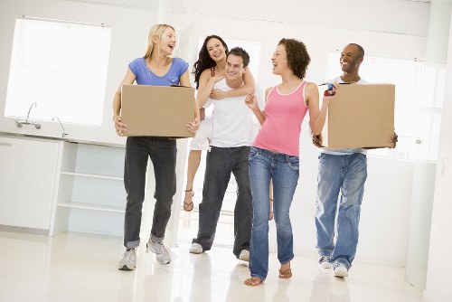 Team planning office removals in Bayswater with boxes and workstations