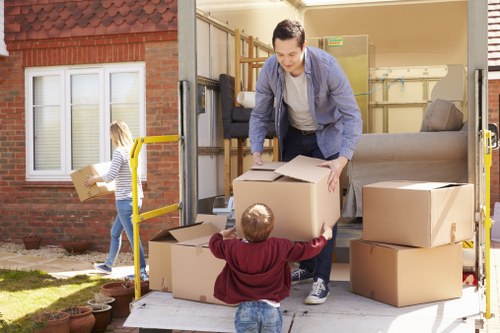 Careful packing of books and electronics for student removals