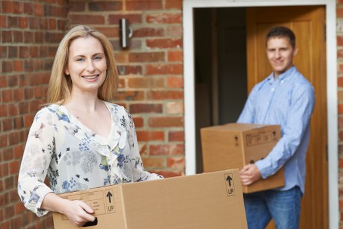 Local house movers in Bayswater carrying furniture through a residential property
