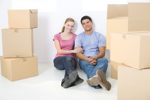 Professional movers carrying furniture during a same day move