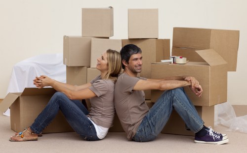 Professional removal specialists handling furniture with care during relocation