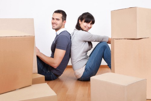 Staff assessing lifting risks before moving heavy items